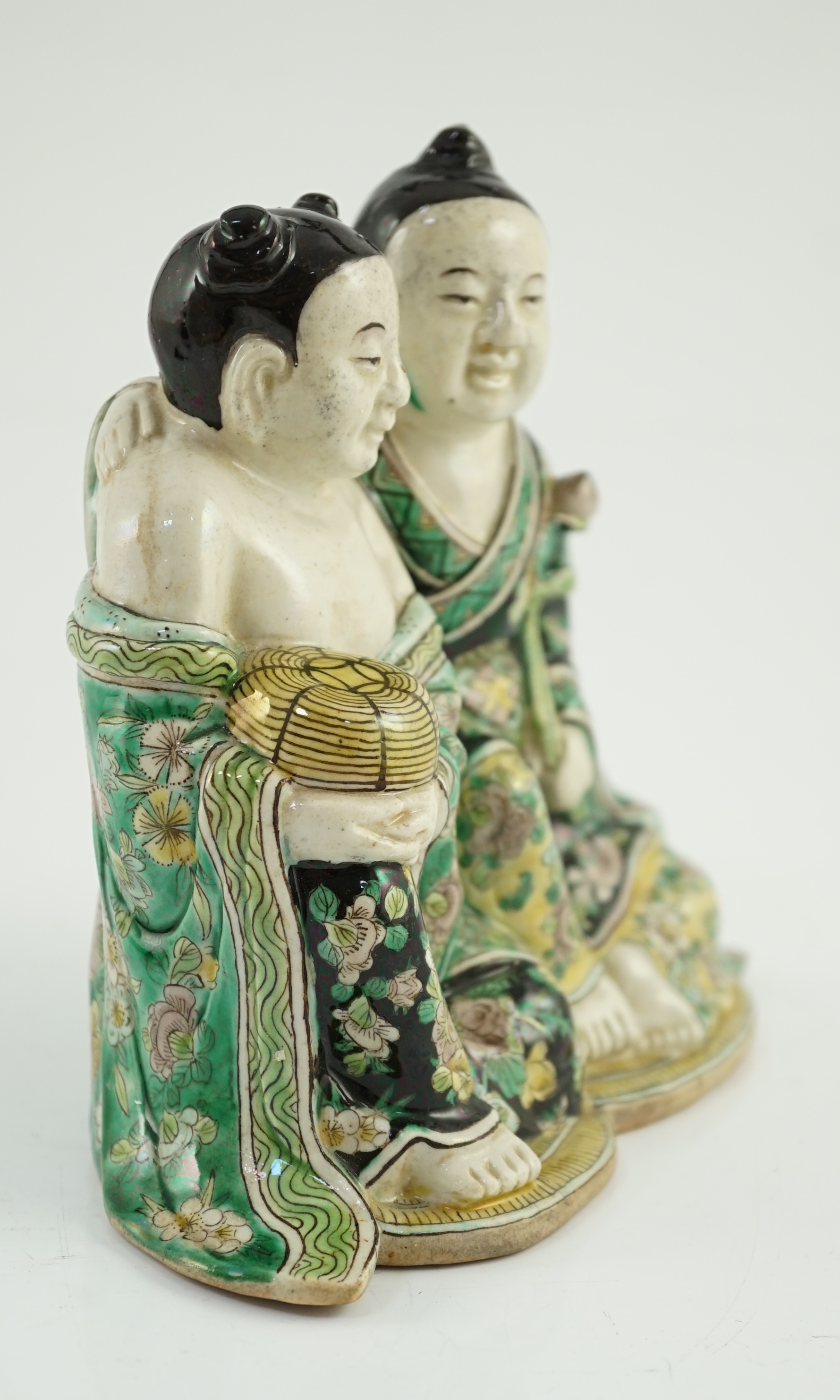 A Chinese famille verte enamelled biscuit group of the Hehe Erxian, possibly 19th century